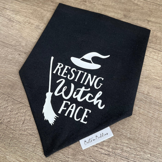 Black bandana with 'Resting Witch Face' text and broom design on a wooden surface